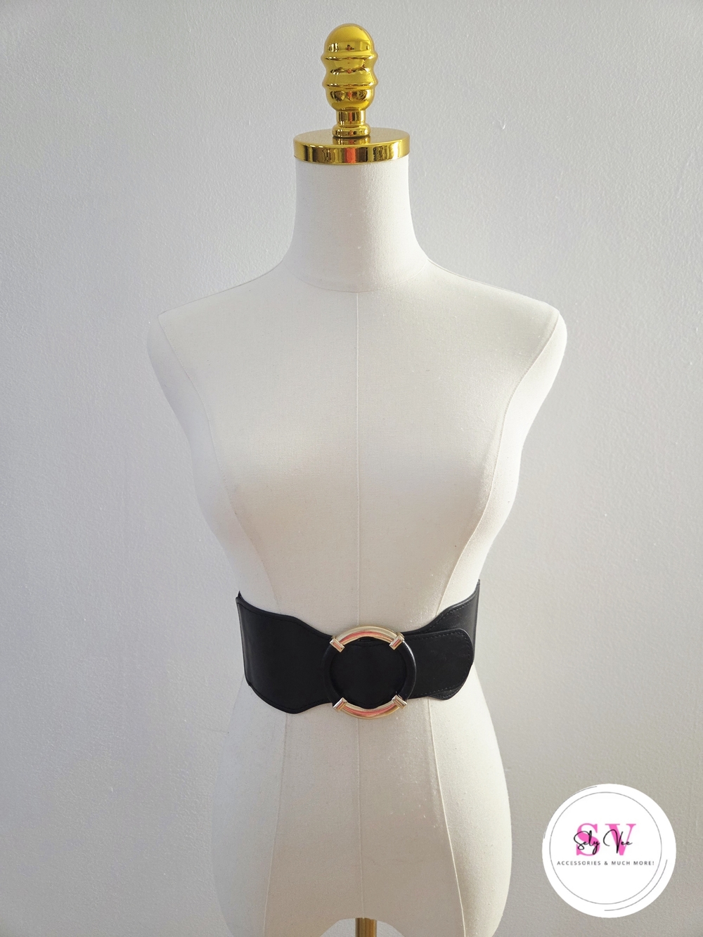 Stretchy black waist belt with gold buckle